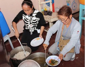 DSWD employees prepare food for the pregnant women who are part of the supplemental feeding operations in response to the recent armed conflict situation in Zamboanga city