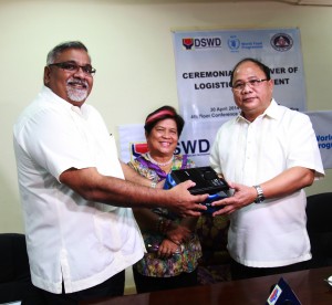 DSWD Secretary Corazon Juliano-Soliman witnesses the turnover of satellite phones donated by World Food Programme represented by Praveen Agrawal, country director Philippines to the Office of Civil Defense represented by Director Honorato De Los Reyes, executive officer.