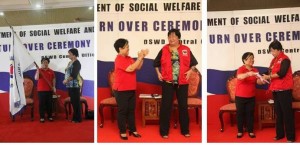 Incoming DSWD Sec. Judy Taguiwalo (right) receives the official flag of the Department, a DSWD vest, and the transition reports from outgoing Sec. Corazon Juliano-Soliman (left), all symbolizing the responsibilities of the new management during the turnover ceremony at the DSWD Central Office this morning.