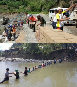 Police, volunteers, social workers and ordinary citizens imbibe the Bayanihan spirit as they cross a river to deliver relief resources to far-flung communities affected by Typhoon 'Lawin.'
