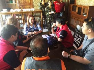 DSWD Sec. Judy Taguiwalo (right in red vest) , Assistant Secretary Jose Antonio Hernandez (right), DREAMB Director Felino O. Castro V (left) and DSWD CO and FO IV-A staff confer with the PSWDO of Lucena, Quezon and Southern Luzon Command during the first leg of the MIMAROPA and CALABARZON monitoring of the post Typhoon Nina situation in Lucena City.