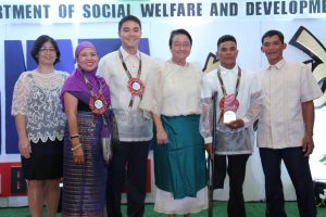DSWD Secretary Judy M. Taguiwalo (4th from left); Assistant Secretary Jose Antonio R. Hernandez (3rd from left), PANATA Awards 2016 Committee Chairperson; Undersecretary Mae Fe Ancheta-Templa (2nd from left); and, Capability Building Director Marie Angela S. Gopalan (left) beam as they pose with Julie Taniongon (2nd from right) from Igsoro, Bugasong, Antique who bagged the Salamat Po Award Individual Category. 
