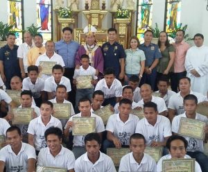 Community-based drug rehabilitation program graduates from Tanauan, Leyte proudly show their Certificate of Recognition during their graduation ceremony held at the Bishop’s Palace, in Palo, Leyte last week. With them are DSWD-FO VIII Regional Director Restituto Macuto (last row, third from left), Tanauan Mayor Pelagio Tecson, Jr. (fifth from left), Palo, Leyte Archbishop John  F. Du, D.D. (sixth from left), and other  government executives.