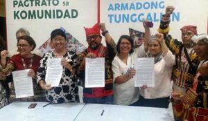 DSWD Secretary Judy Taguiwalo (2nd from left), Undersecretary Malu Turalde-Jarabe (left), PASAKA Chairperson Kerlan Fanagel (3rd from left), and other Lumad leaders beam after the signing of the memorandum of understanding for the provision of social services to Lumad communities in Mindanao.