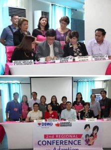 Photo 1: Department of Justice (DOJ) Secretary Vitaliano Aguirre II (in gray) signs the Memorandum of Agreement (MOA) which formally includes the DOJ as one of the lead agencies that will promote the legal adoption advocacy.  Photo 2: Department of Social Welfare and Development (DSWD) Undersecretary Virginia Orogo (in red), Department of Interior and Local Government-National Barangay Operations Office (DILG-NBOO) Director Leocadio Trovela (seated left), Department of Education (DepEd) Assistant Secretary Tonisito Umali (seated right) with officials from the Department of Health (DOH), DSWD, DILG, and DepEd after the signing of the renewed commitment of the four government agencies to strengthen their partnership and address the challenges of legal adoption in the Philippines.