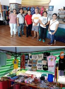 Photo 1: Department of Social Welfare and Development (DSWD) Field Office I staff together with the members of the Glassy Waves of San Juan, La Union Sustainable Livelihood Program Association (SLPA) and Mr. Bob Hunt (third from left), the group's business partner.   Photo 2: The merchandise being sold by the association, which is now a leading souvenir and T-shirt printing services provider in the town.