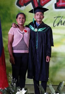 DSWD Expanded Student’s Grant-in-Aid Program for Poverty Alleviation (ESGP-PA) grantee Raymark Khalid Cabading poses with his mother, Carmelita, during the graduation rites of Sultan Kudarat State University in Lutayan, Sultan Kudarat.