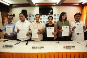Department of Social Welfare and Development (DSWD) Secretary Virginia N. Orogo (third from right) and Department of Health (DOH) Secretary Francisco Duque III (third from left) present the newly-signed Joint Administrative Order on Streamlining Access to Medical Assistance Fund of the Government. Also in photo are (from left to right):  Jose R. Reyes Memorial Medical Center Chief Dr. Emmanuel F. Montaña, Jr., Presidential Assistant for Special Concerns Wendel Avisado, PhilHealth Vice President for Corporate Affairs Group Dr. Shirley Domingo, and PCSO OIC Assistant General Manager Rubin Magno.