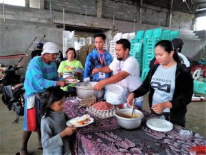 Members of MAT Echague distribute food to Typhoon Rosita-affected families in the municipality