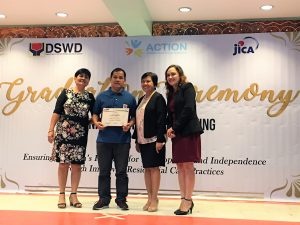 Mr. Ronald Busnagan, a houseparent from Nayon ng Kabataan, a residential care facility of the  Department of Social Welfare and Development (DSWD), receives his Certificate of Completion after finishing the training on houseparenting provided by the DSWD, Japanese non-profit group, A Child’s Trust is Ours to Nurture (ACTION), and Japan International Cooperation Agency (JICA) under the project, "Ensuring Children’s Potential for Development and Independence Through Improved Residential Care Practices.”