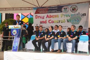 Department of Social Welfare and Development (DSWD) Assistant Secretary Jose Antonio Hernandez (far left) highlights the Yakap Bayan program during his speech at the Drug Abuse Prevention and Control (DAPC) week kick off celebration in Lucban, Quezon.  Also present in the activity are (from L-R) Dangerous Drugs Board (DDB) Usec. Earl Saavedra, Lucban Mayor Celso Olivier Dator, DDB Sec. Catalino Cuy, and DDB Usec. Benjamin Reyes.