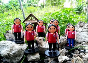 The miniature paper quilling dolls of Department of Social Welfare and Development (DSWD) personnel in the iconic DSWD red vest created by Cebu-based artist Libeth Paracuelles.