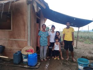 Manong Romeo, with his wife and grandchildren, pose in front of their humble abode in Jabonga, Agusan del Sur. Having less in life did not prevent Manong Romeo’s family to make a difference in other people’s lives.