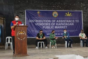 Department of Social Welfare and Development (DSWD) Secretary Rolando Joselito D. Bautista delivers his message for beneficiaries of financial assistance at Kapatagan Public Market. 