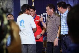 President Rodrigo Roa Duterte joins DSWD Secretary Rolando Joselito Bautista during the distribution of benefits to former rebels in Leyte on January 23, 2020.