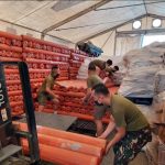 Military personnel haul 500 laminated sacks for delivery to Butuan-Surigao. The rolls of laminated sacks sized 8 ft x 100 meters when cut into 10 meters could benefit about 5,000 individuals and/ or families affected by Typhoon Odette in CARAGA Region.