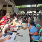 Social workers of the Department of Social Welfare and Development (DSWD) Field Office I assess the requirements of parents and guardians applying for educational assistance in Don Mariano Marcos Memorial State University, San Fernando, La Union on Saturday, August 27.