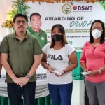 DSWD Operations Group Undersecretary Jerico Javier (second from left) and Lian Mayor Joseph Peji (right) hand over Php15,000 livelihood assistance grant to each of the beneficiaries of the Sustainable Livelihood Program (SLP) from Lian and Calatagan, Batangas.