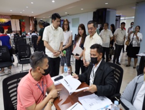 Department of Social Welfare and Development (DSWD) Officer-in-Charge (OIC) Eduardo M. Punay (left) and Commission on Elections (COMELEC) Chair George Erwin Garcia (right) inspect the ongoing voter registration activity, under the Register Anywhere Project (RAP), at the DSWD Central Office. Also joining the inspection are DSWD 72nd Anniversary Committee Chair, Undersecretary Sally Navarro (2nd from left); and Vice-Chair, Assistant Secretary Ivy Grace Rivera (2nd from right).