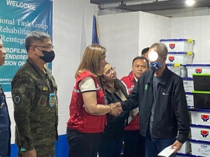  Department of Social Welfare and Development (DSWD) Assistant Secretary Dianne Rose Cajipe hands over the Department’s financial assistance to a former private armed group member in Camp Datu Akilan Ampatuan, Brgy. Poblacion Mother, Shariff Aguak, Maguindanao, on Monday, January 30.
